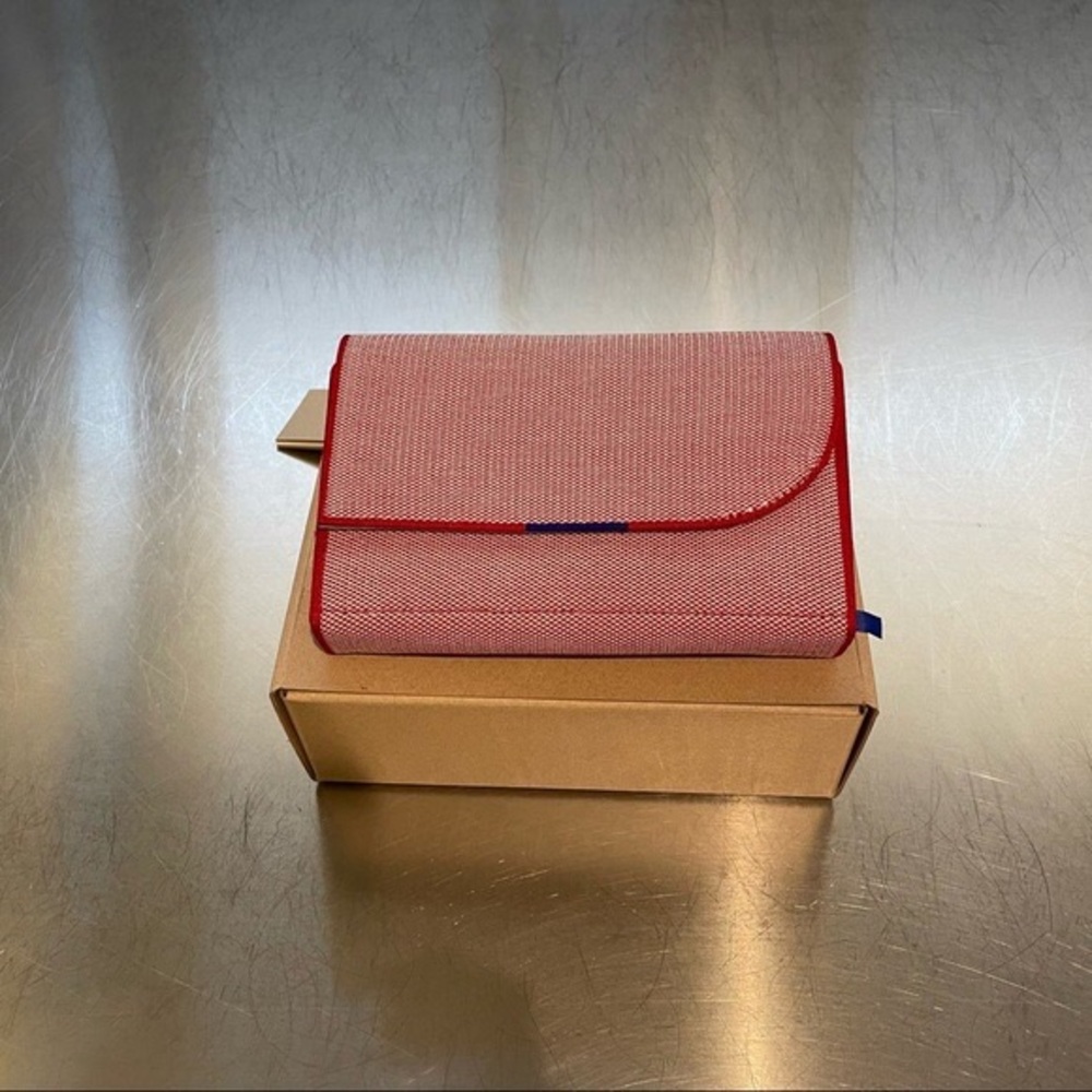 Rothy’s belt bag in poppy.